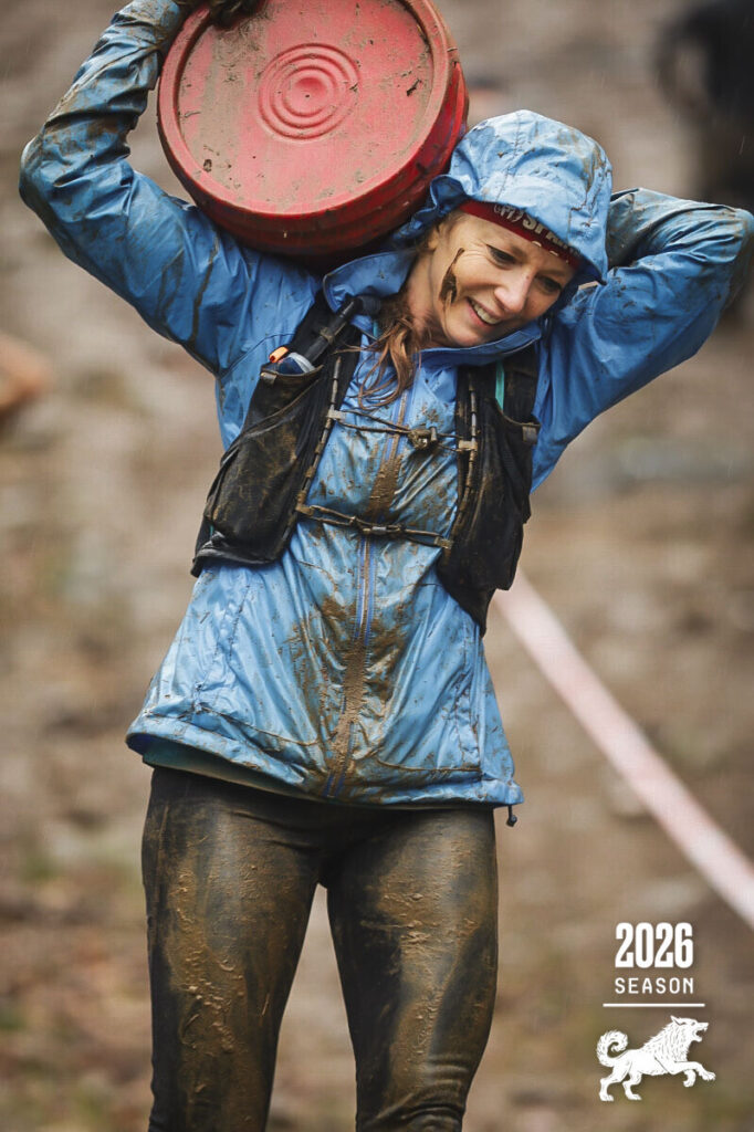 Jill carrying a bucket in the rain.